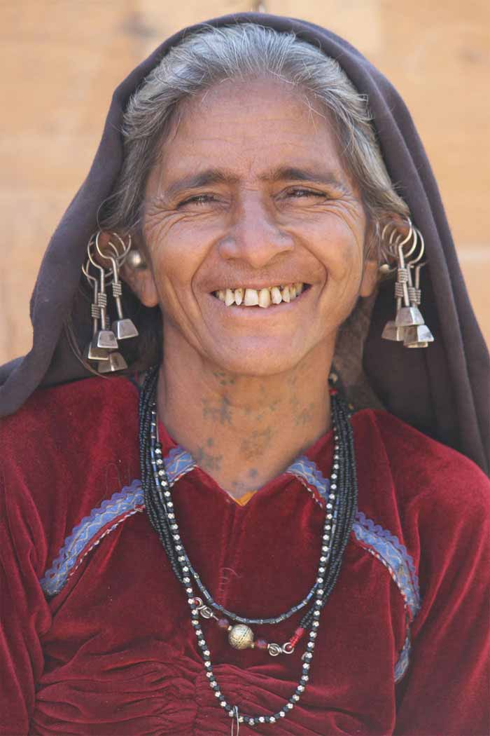 A Kutchhi Rabari Tribe lady with tattoos on her neck.