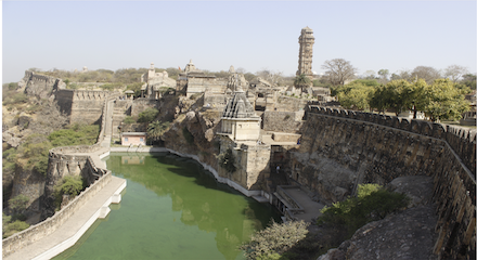 Travelling to India? The Ideal Way to Explore Panoramic India 9 Old hilltop castle with stone walls, towers and ramparts and a view of the valleys in the distance.