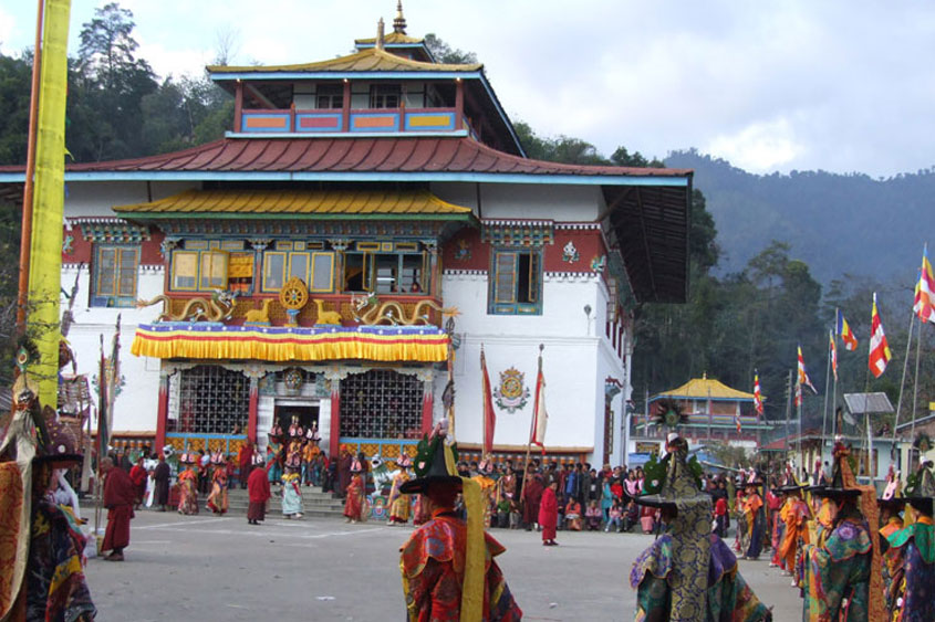 Traditional Buddhist monastery with ornate decorations and festival celebration with monks